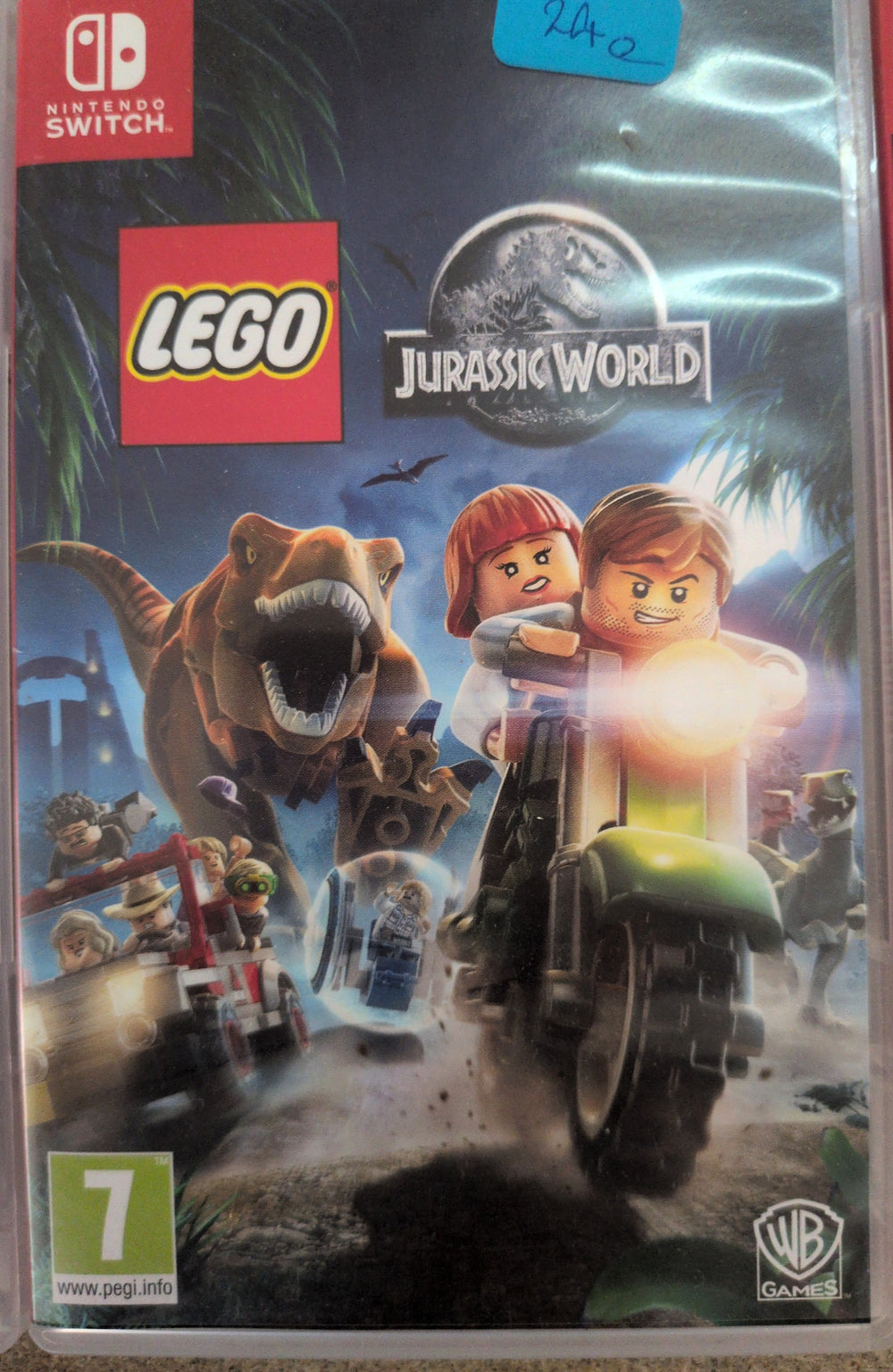 Photographed front cover and case of LEGO Jurassic World for Nintendo Switch, blue sticker copy