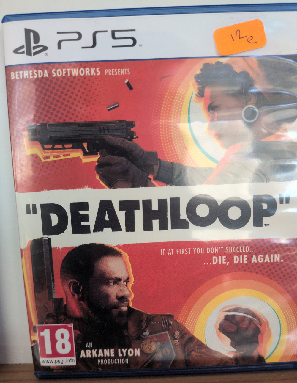 Photographed front cover and case of Deathloop for PS5