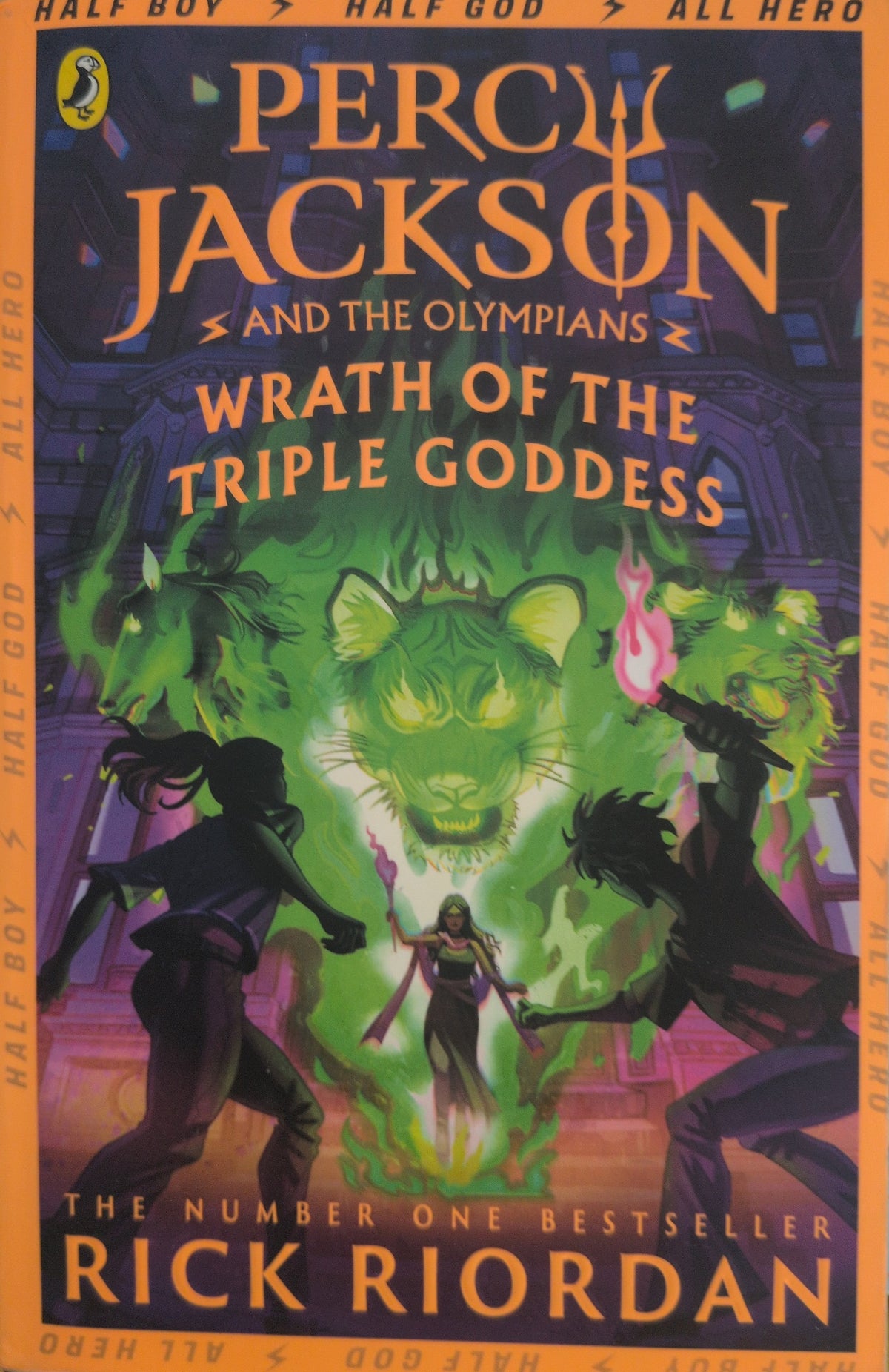 Actual photographed front cover of Percy Jackson and the Olympians: Wrath of the Triple Goddess by Rick Riordan
