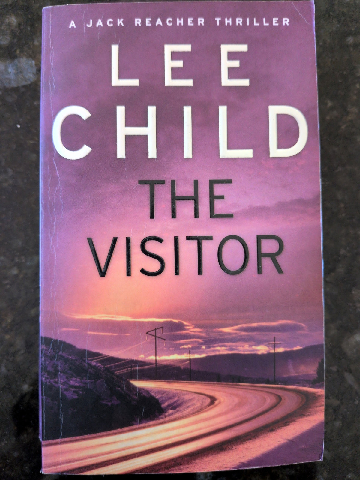 Actual photographed front cover of The Visitor by Lee Child