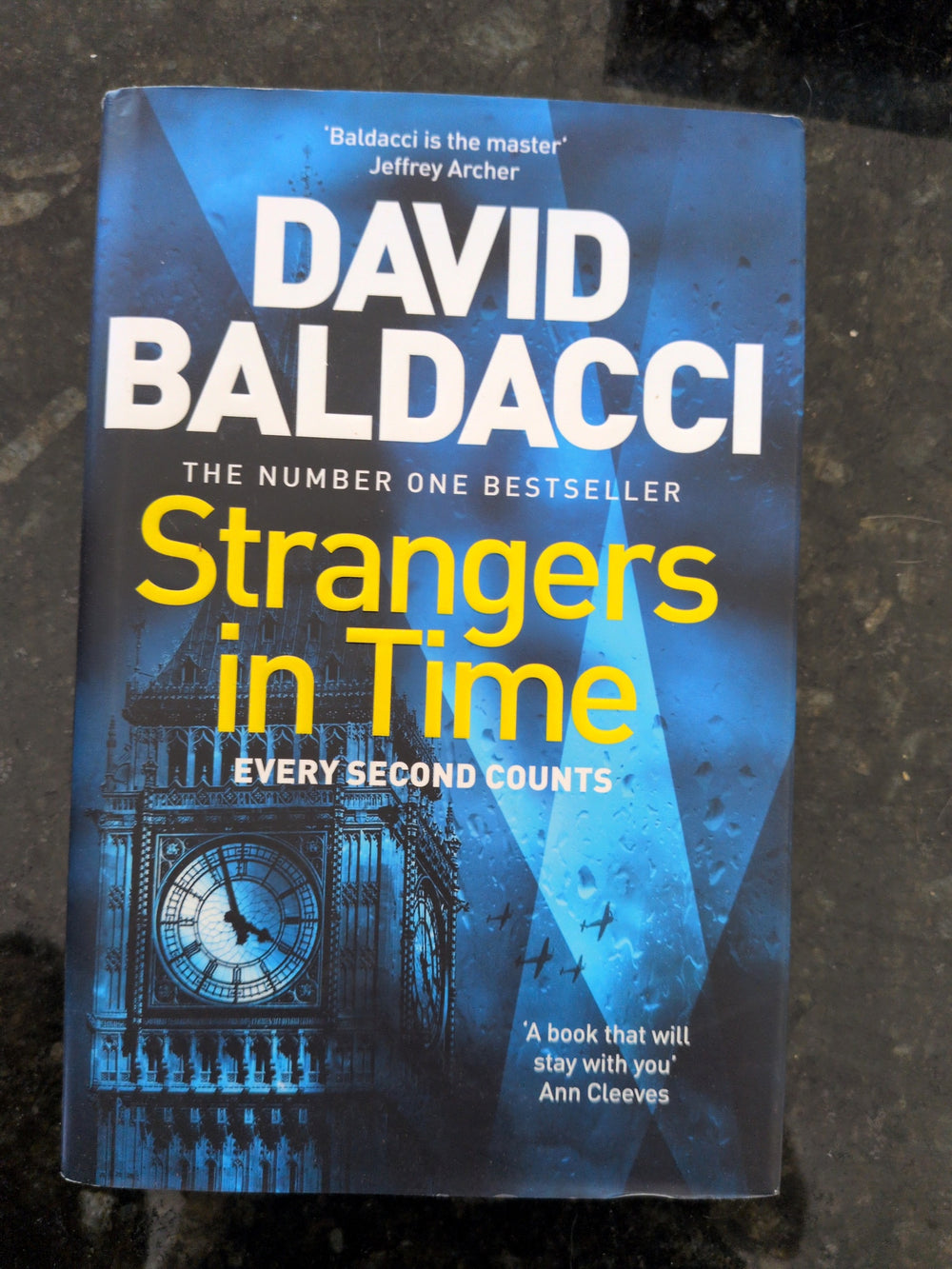 Actual photographed front cover of Strangers in Time by David Baldacci