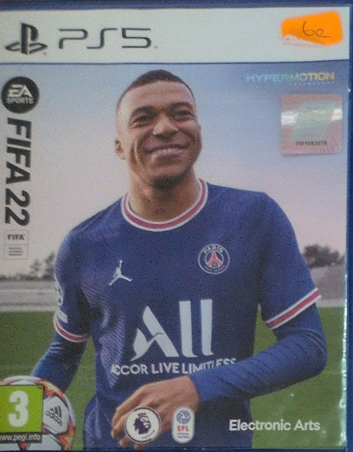 Photographed front cover and case of FIFA 22 for PS5