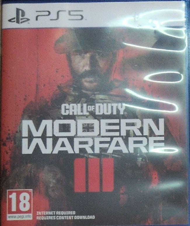 Photographed front cover and case of Call of Duty: Modern Warfare III for PS5
