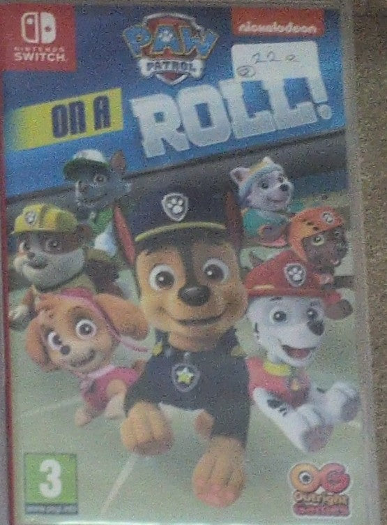 Photographed front cover and case of PAW Patrol: On a Roll! for Nintendo Switch
