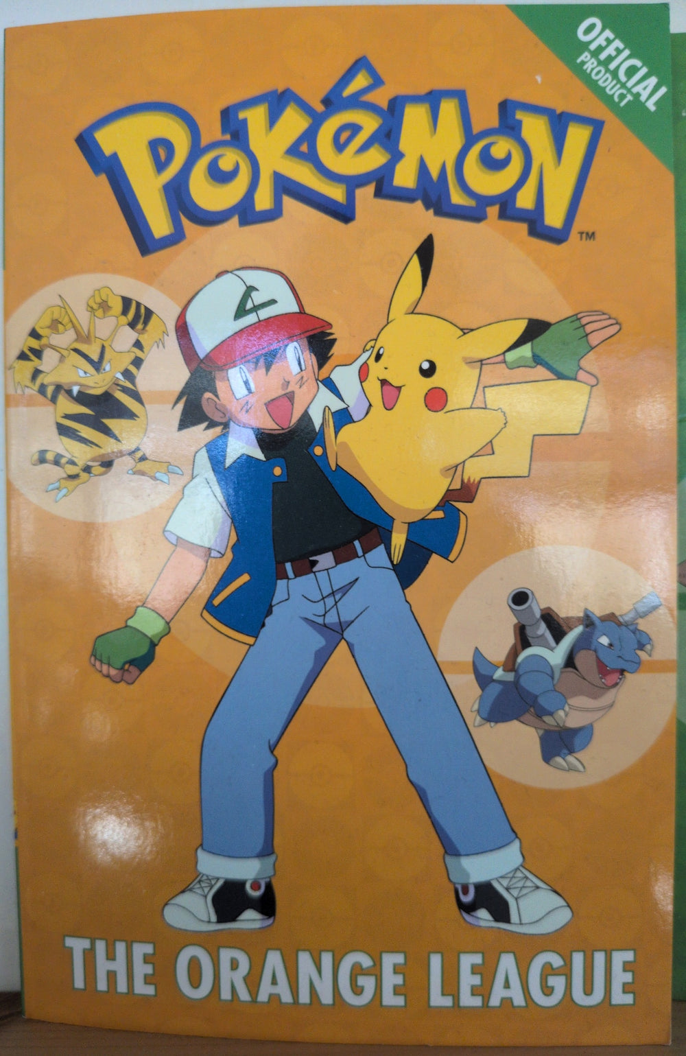 Photographed front cover of Pokémon: The Orange League, paperback